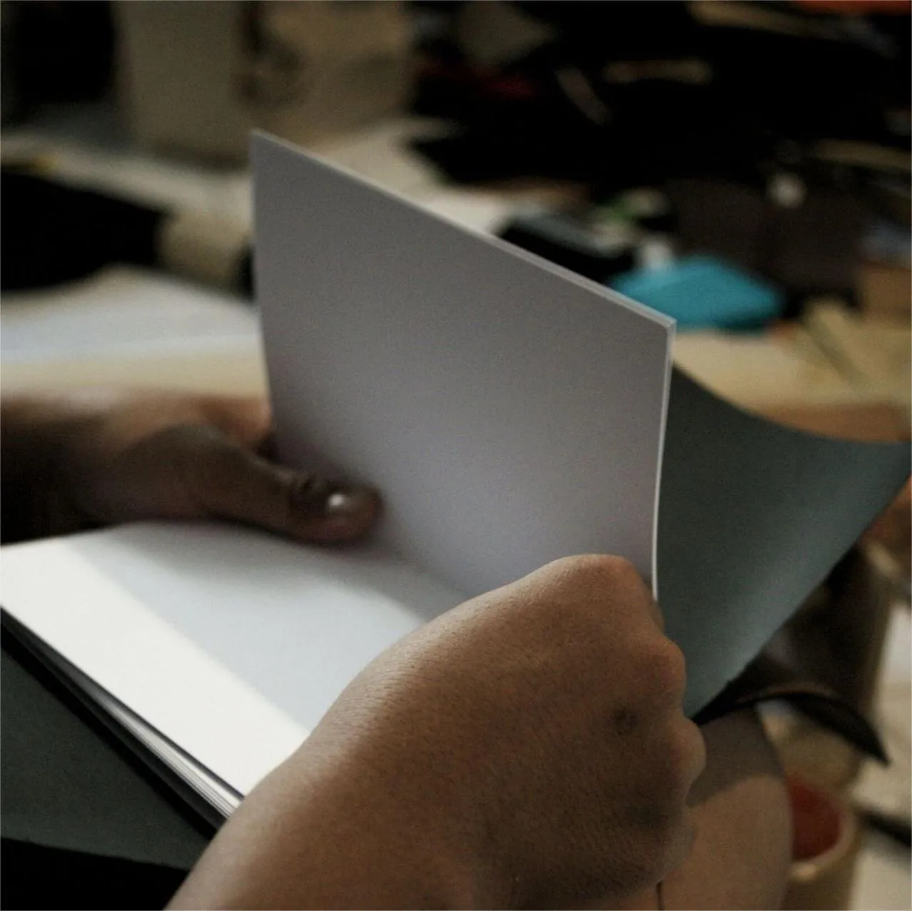 Hibrkraft user generated content hands opening notebook proses jahit