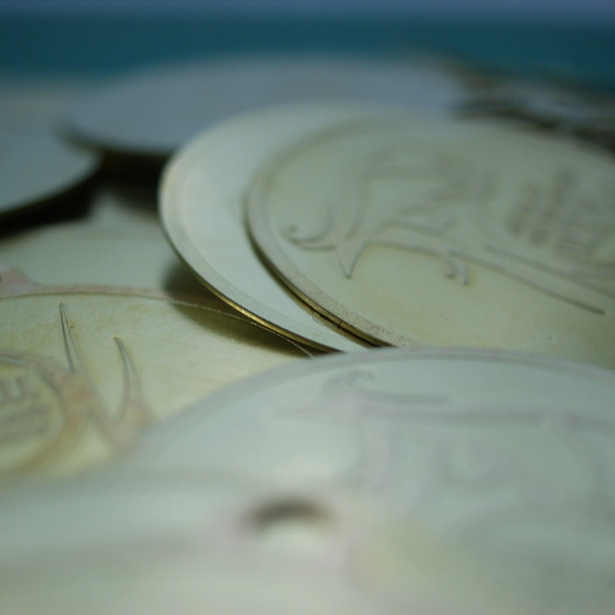 A pile of circular leather tags with the embossed Pemprov Riau logo.